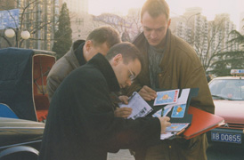 filling out a laowai post card on the street in beijing
