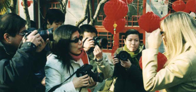 sympathic foreign women in the spot of the journalists